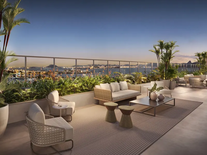 Terraço do salão gourmet do Glória Residencial com lounge e vista para a cidade